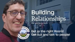Real estate investors networking and building relationships at a REIA meeting